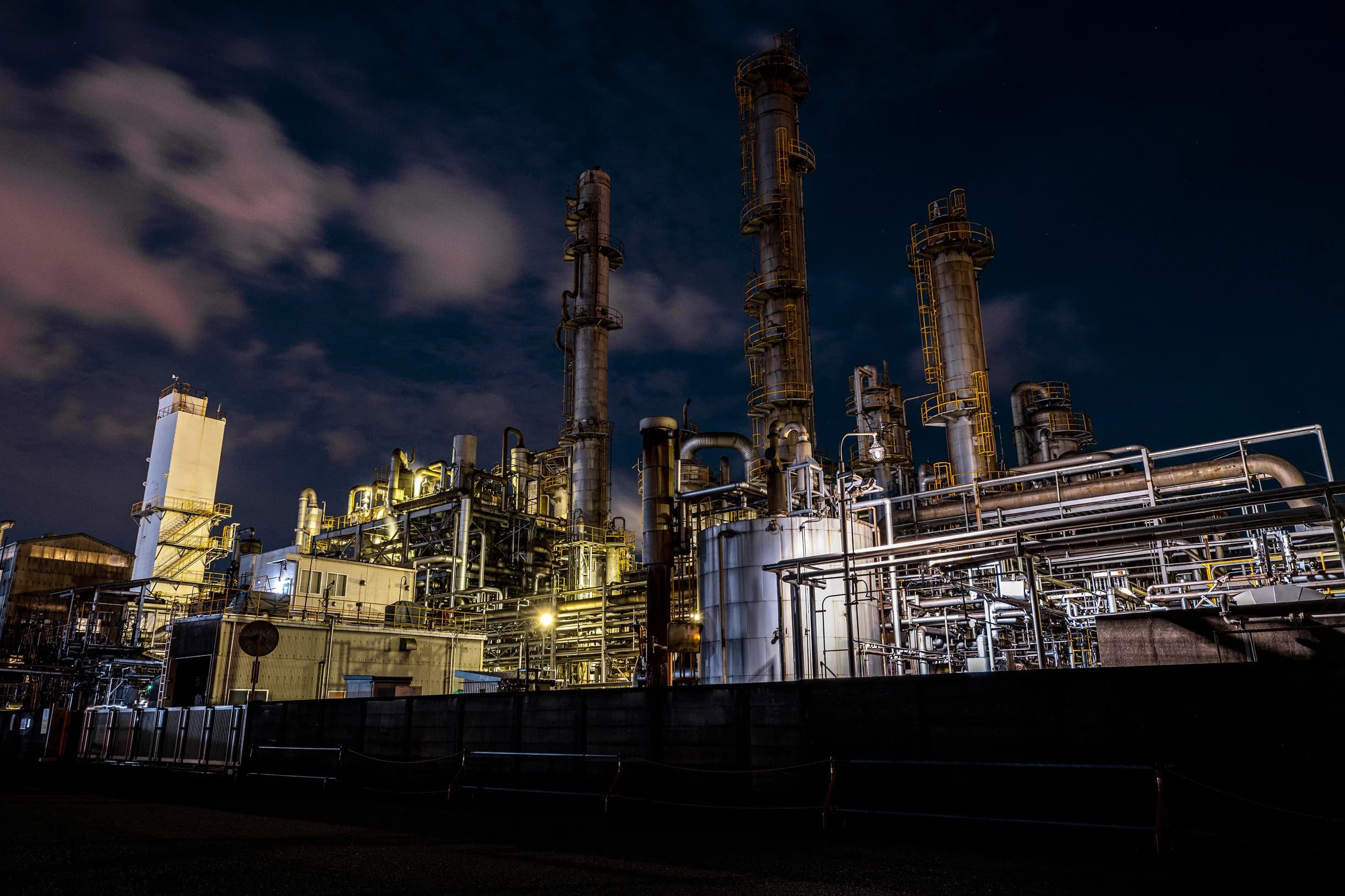 Industrial background towers at night